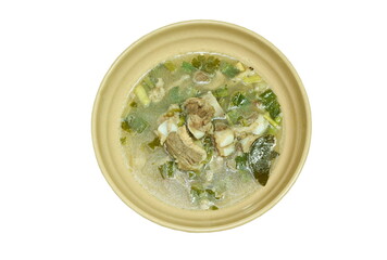 hot and spicy pork bone with tamarind and Thai herbs soup on bowl  