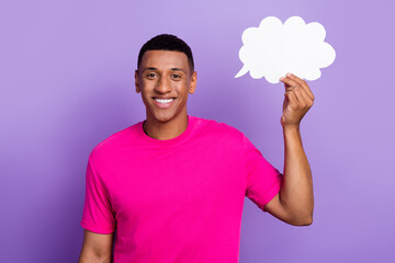 Portrait of cheerful toothy beaming smiling student guy smart intellectual hold paper cloud idea copyspace advert isolated on violet color background