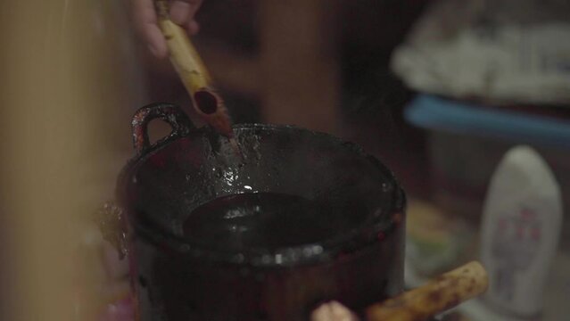 Batik Ink on the pan and Traditional stove to make batik tulis