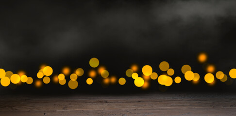 Wooden table with blurred bokeh lights and smoke effect on dark background. Christmas background.