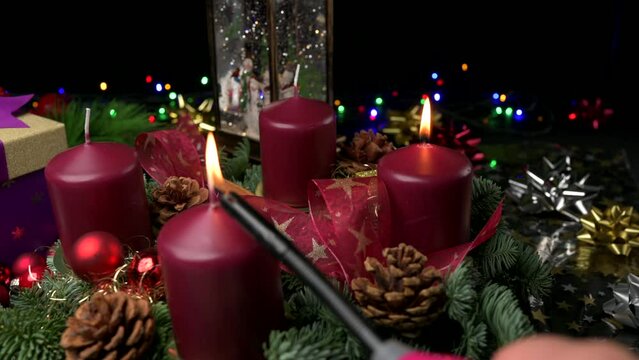 Advent wreath one lit candle and second being lit slider shot space for copy