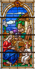 ALAGNA, ITALY - JULY 16, 2022: The Holy Family in the stained glass of church  San Giovanni Battista by O. Janni from begin of 20. cent. - obrazy, fototapety, plakaty