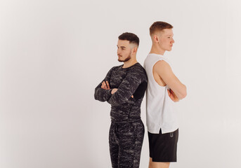 Athletic young man doing workouts at home, man doing training, warm up before weight exercise.