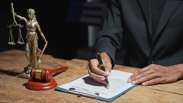 Lawyer man holding pen with contract or agreement document to the customer for signing in courtroom legal, Sign a contract business.