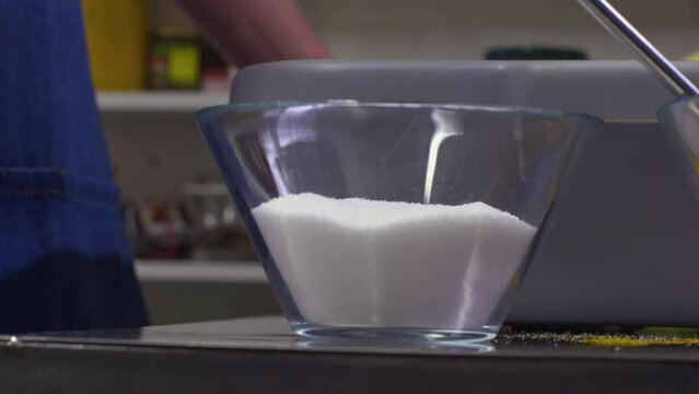Add a spoon of salt to the ingredients bowl recipe seasoning step
