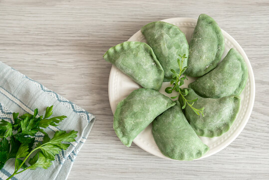 Green dumplings with spinach. The dumplings are just molded, but not yet ready to eat. They need to be cooked