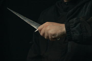 hand holding medieval antique dagger knife