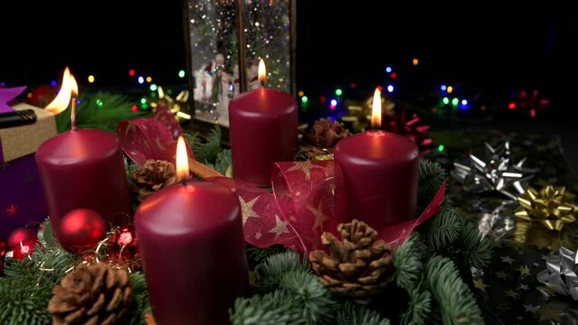 Advent wreath three lit candle and fourth being lit slider shot space for copy
