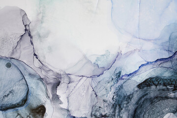 Alcohol ink abstract background. Blue golden luxury acrylic paint in water. Texture of marble....