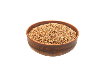 buckwheat in a clay bowl on a white background. the concept of a good harvest of buckwheat