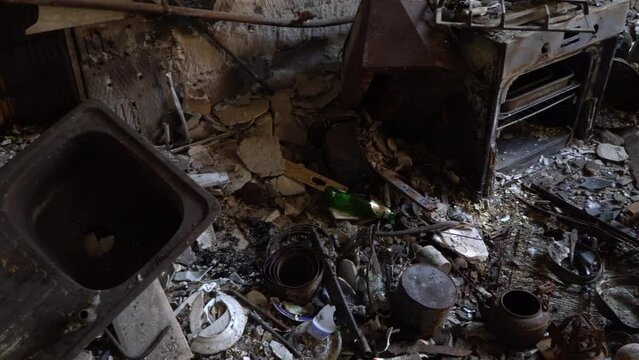 Burned-down apartment building and things close-up. Left belongings of residents. Consequences of fire in apartment house