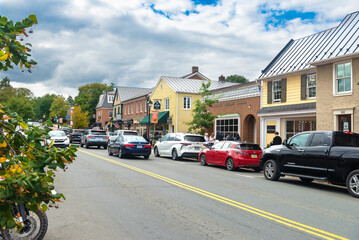 central street of the ancient town near Washington. Ancient buildings of shops, hotels and restaurants., strolling tourists.
