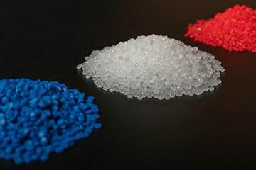 Obraz na płótnie Canvas Close-up of plastic polymer granules. hand hold Polymer pellets. polymer plastic. compound polymer. 