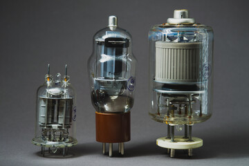 Old vacuum tube on gray background
