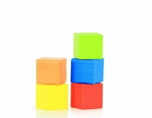 Closeup of colorful wooden blocks for children on a white background