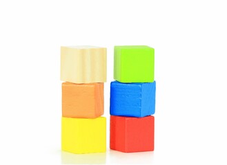 Closeup of colorful wooden blocks for children on a white background