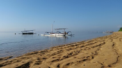 Fototapeta na wymiar Fishing boat on the shore on a sunny day