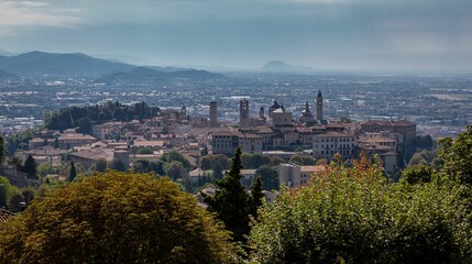 Obraz premium Skyline of Bergamo, Spain with trees in front on a sunny day
