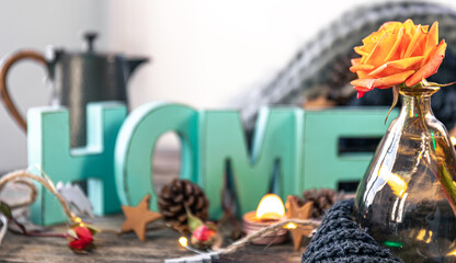 Cozy background with decorative word Home and home decor details.