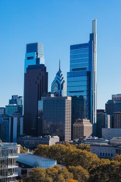 Vertical Shot Of A Comcast Technology Center Against A Blue Sky