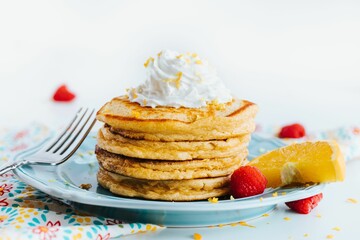Closeup of pancakes with whipped cream