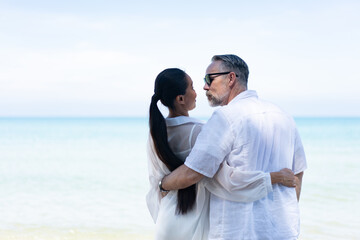 Romantic Couple Walking on the Beach. portrait of living young couple at the beach. Romantic marriage proposal at the seaside on the beach sea. Romantic marriage proposal on the beach.