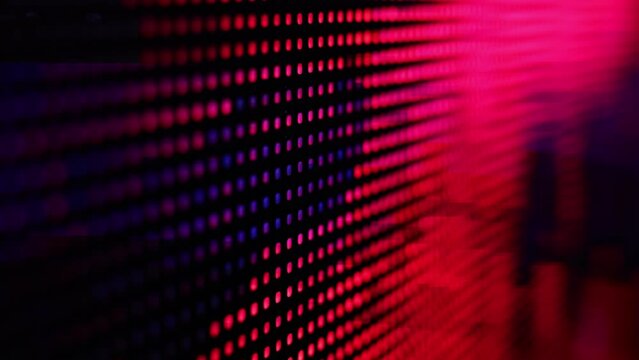 Macro view of a television LED LSD screen at the time of broadcasting a TV program. Colored RGB pixels create an abstract pattern when close up. Abstract Digital Glitch Effect. Glitch VHS Noise.