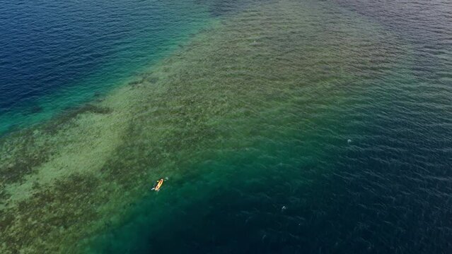 Canoeing over coral reef
