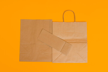set of folded paper bags on a colored background