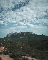 Fototapeta na wymiar Vertical shot of beautiful daytime view of the Montserrat mountain