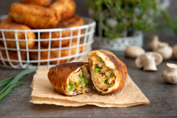 Fried patties with potatoes, mushrooms and green onions, homemade food