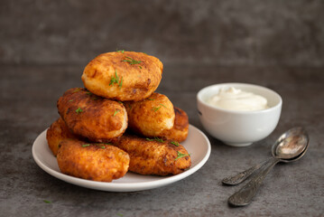 Fried patties with potatoes, mushrooms and green onions, homemade food