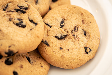 Cookies with chocolate chips close-up, food background.