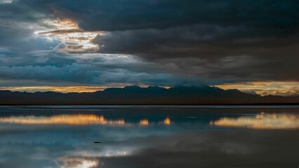 Dark clouds in the sky over the ocean during sunset