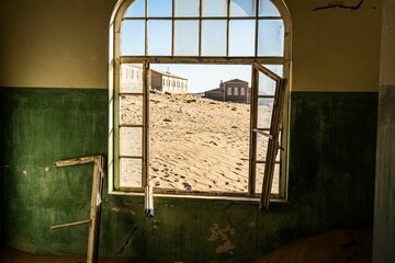 Abandoned house filled with sand