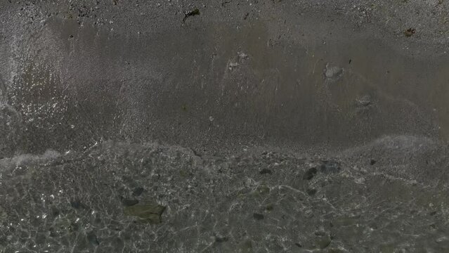 Overhead Birds-Eye-View Sandy Pebble Beach Clear Gentile Lapping Waves Summer Cornwall Aerial