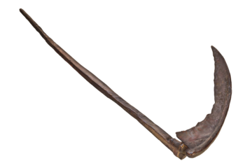 Ancient rusted brown metal scythe