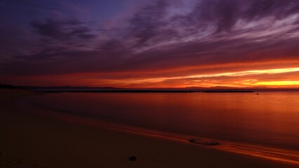 Fototapeta na wymiar Mesmerizing view of the golden purple sunset over the sea