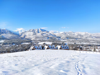 Traditional mountain houses in koscielisko in winter landscape, Tatra mountains, Poland