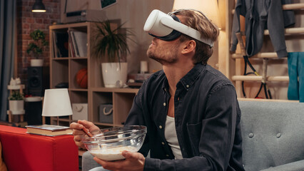 Television Sitcom Concept: Guy Using Virtual Reality Headset Eating Breakfast in Living Room. Funny Sketch About Internet Addiction. Comedy Series Broadcast Network Channel, Streaming Service.