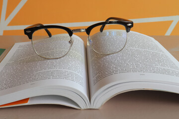 open book with glasses