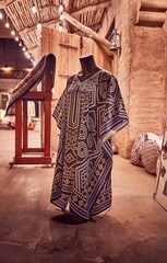 Vertical shot of an amazing traditional Arab kaftan at night market with stunning architecture.