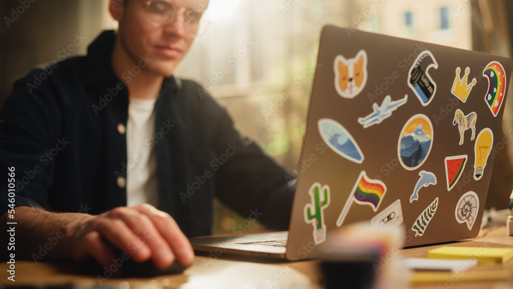 Leinwandbilder focused male software engineer codding on laptop computer and working with inspiration in modern lof