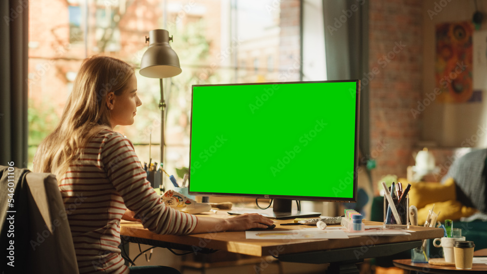 Leinwandbilder focused female fashion designer using keyboard and modelling on desktop computer with green screen c