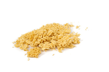crumbled briquette of dry instant noodles on a white background