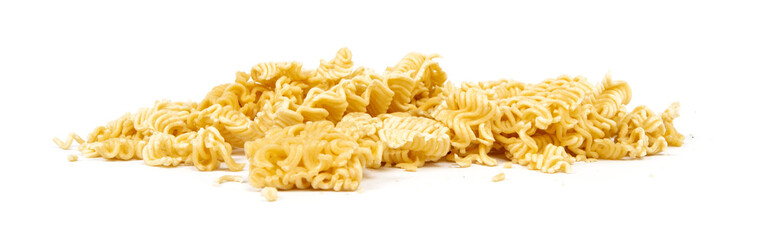 crumbled briquette of dry instant noodles on a white background