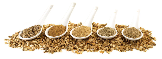 Various Bitter Substances in Porcelain Spoons isolated on white Background