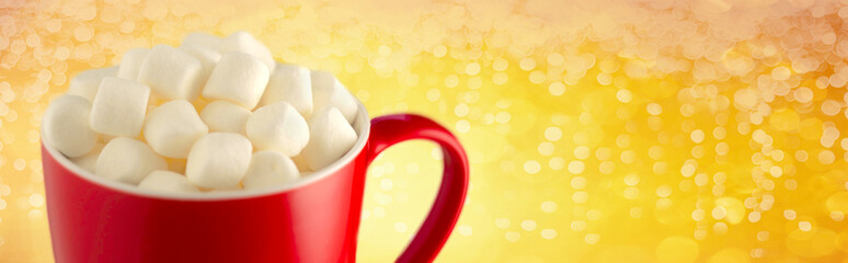 Red cup of cocoa with marshmallow, on Christmas background. Banner for Xmas, traditional christmas and new year concept. copy space for text