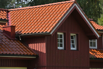 Fototapeta na wymiar New red clay tiles on roof