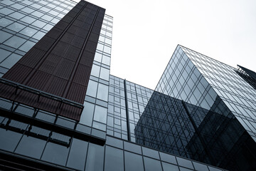 Fototapeta na wymiar Modern business skyscrapers with reflection and symmetry